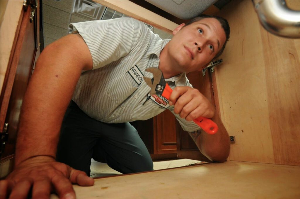 plumber performing plumbing maintenance